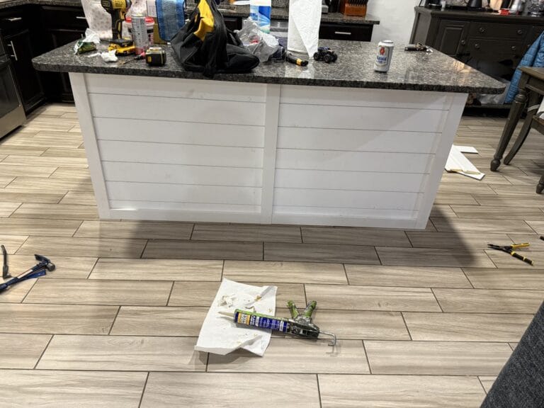 New shiplap installed on a kitchen island before painting