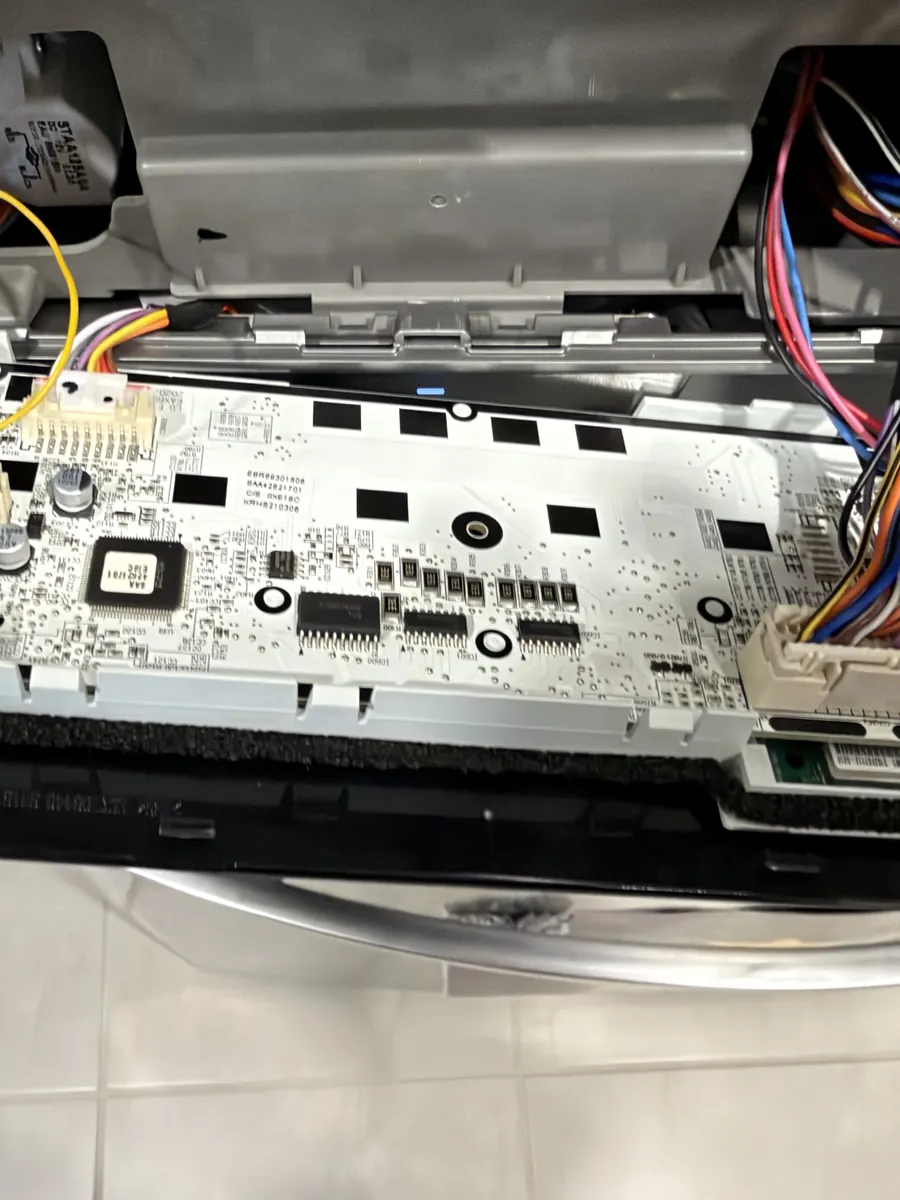 Refrigerator ice and water dispenser control board during professional inspection