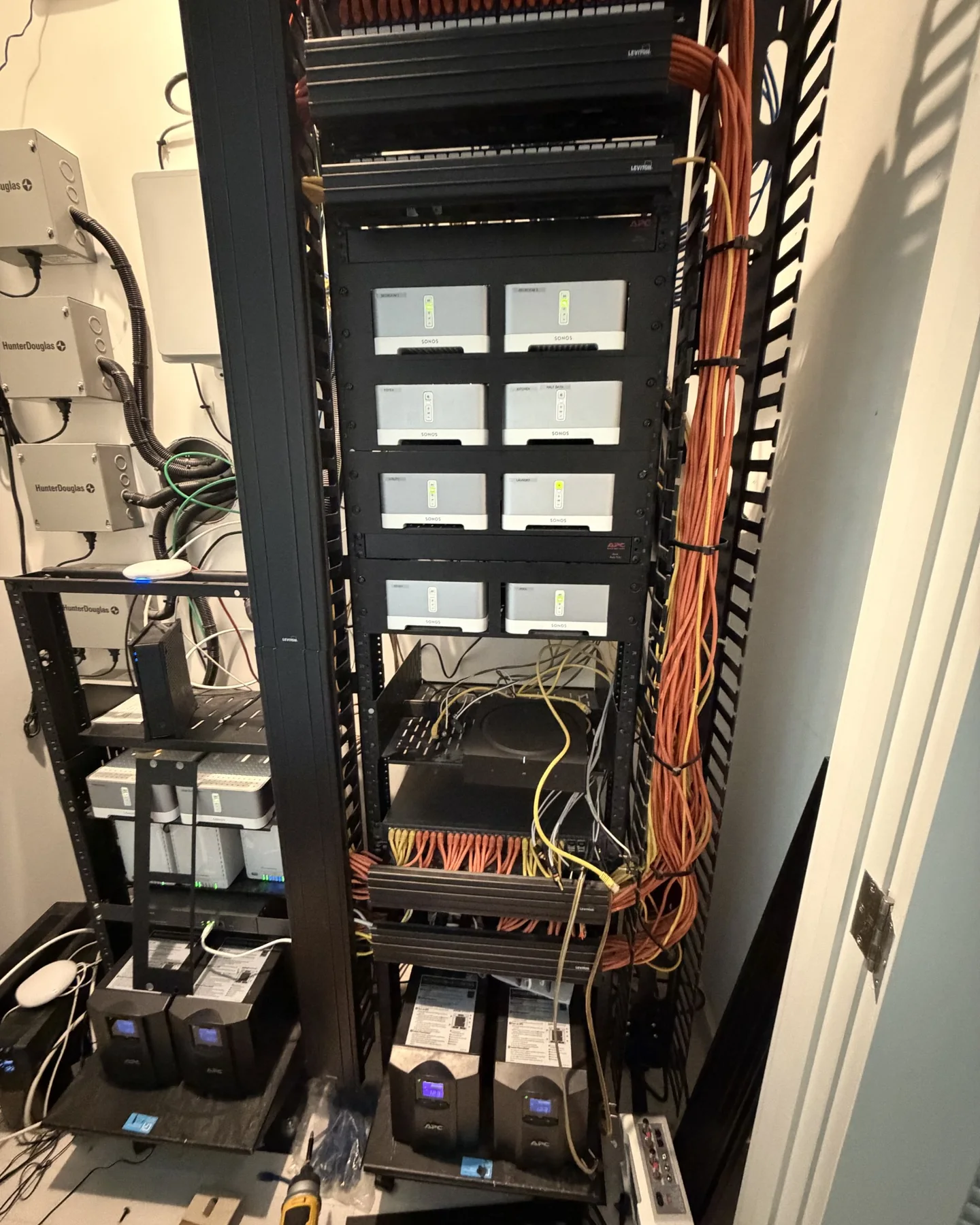 Centralized home network and Sonos equipment rack with managed switching and battery backup